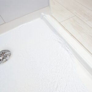 Collapsible Rubber Dam for Barrier Free Shower Bases